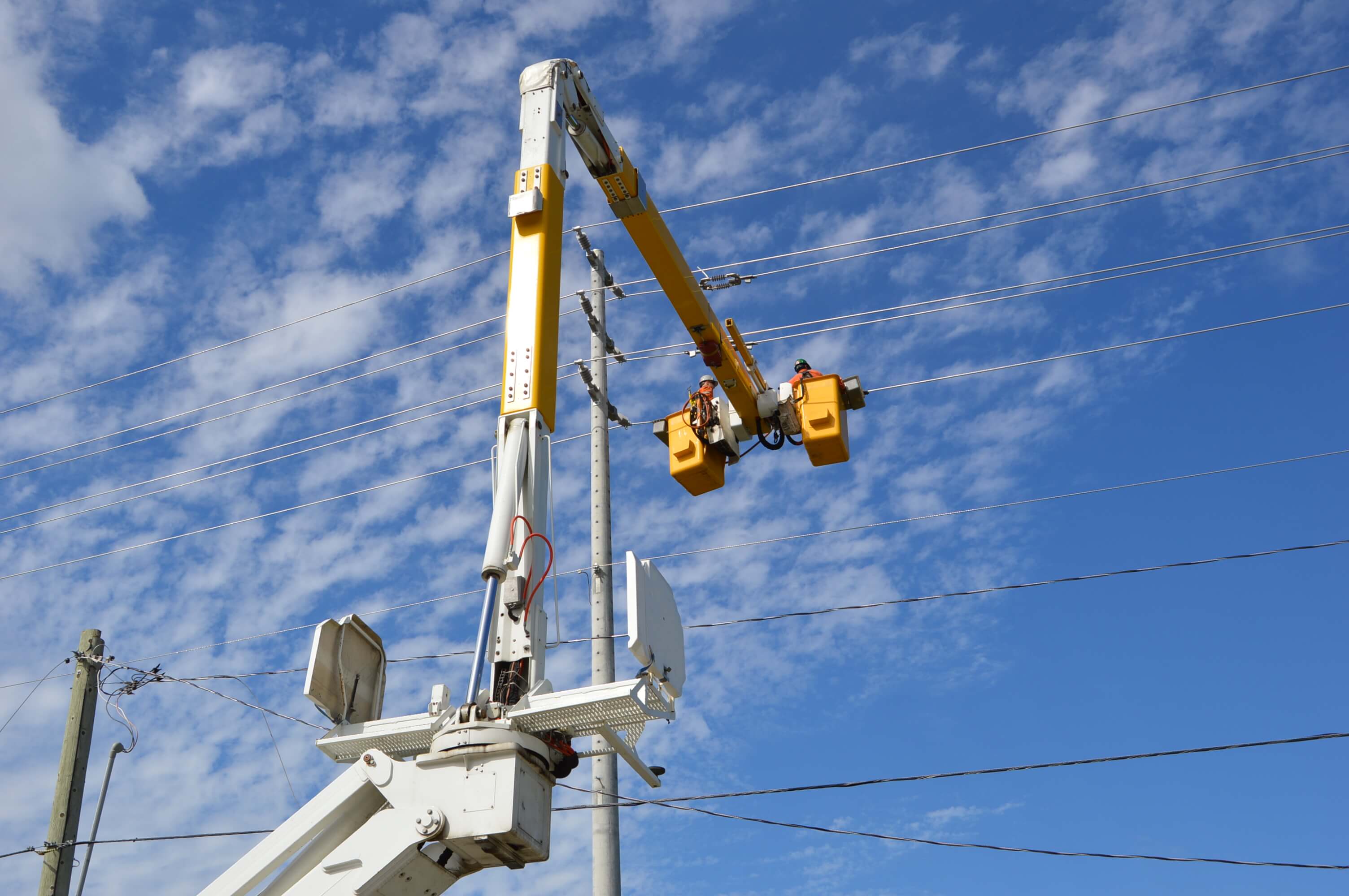 Electric line workers on a bucket truck