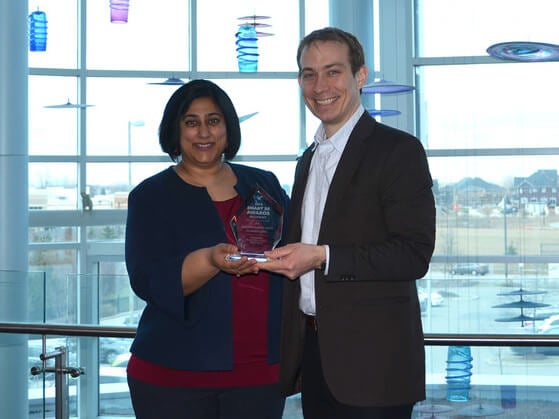 Neetika Sathe and Daniel Carr from GRE&T Centre with the award