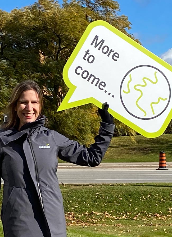 alectra employee holding a placard