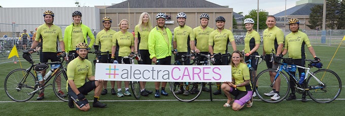 Alectra team holding AlectraCARES banner - Mobile Banner