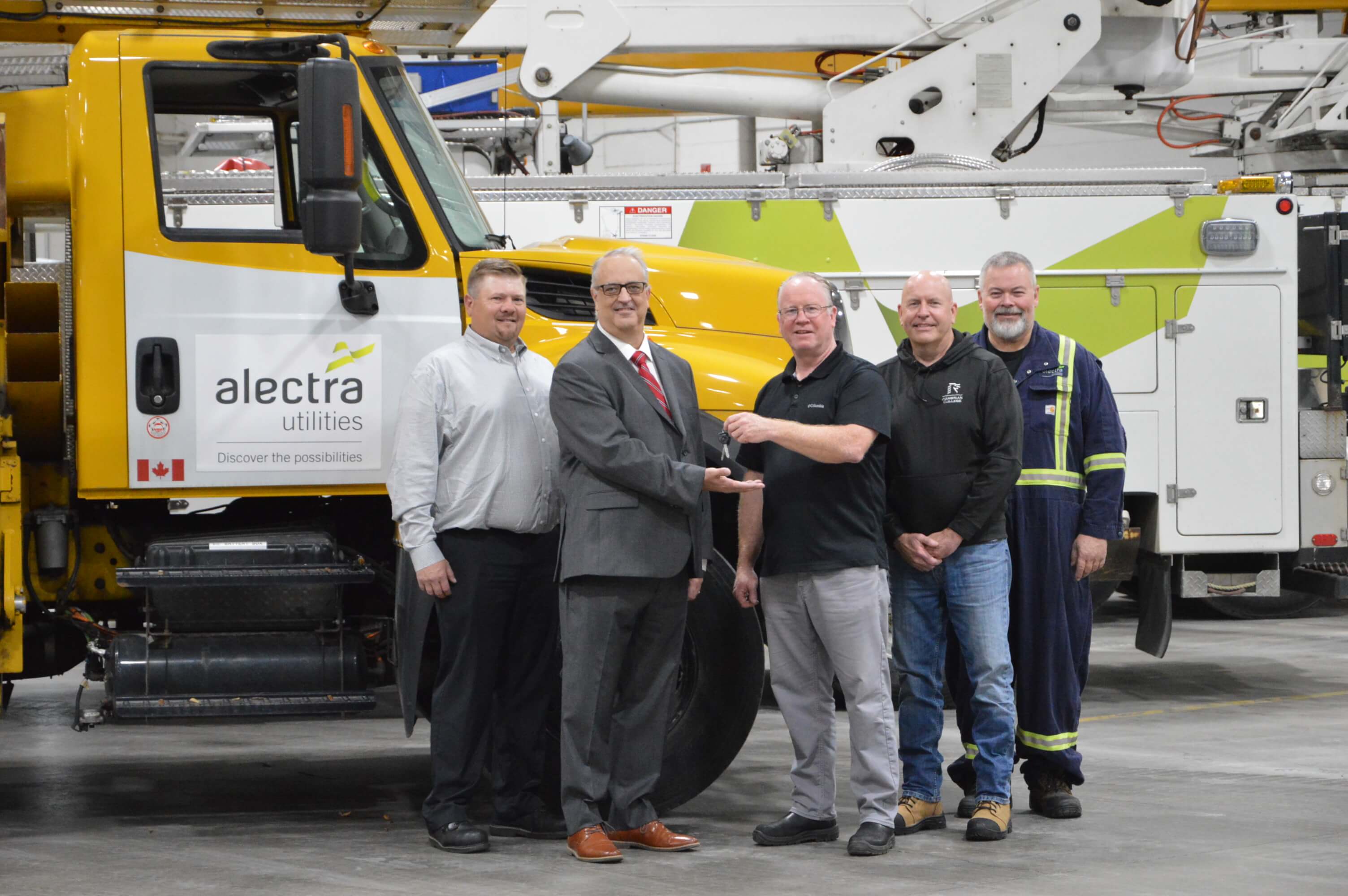 Alectra employees with Cambrian College Powerline team